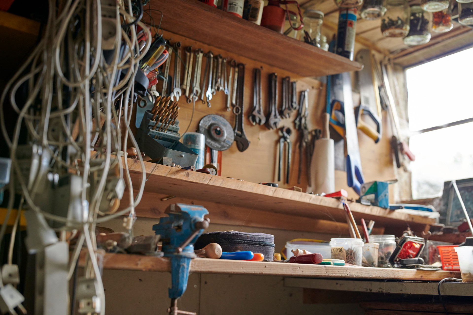 Garage workbench with tools, equipment, and storage showcasing organization and readiness